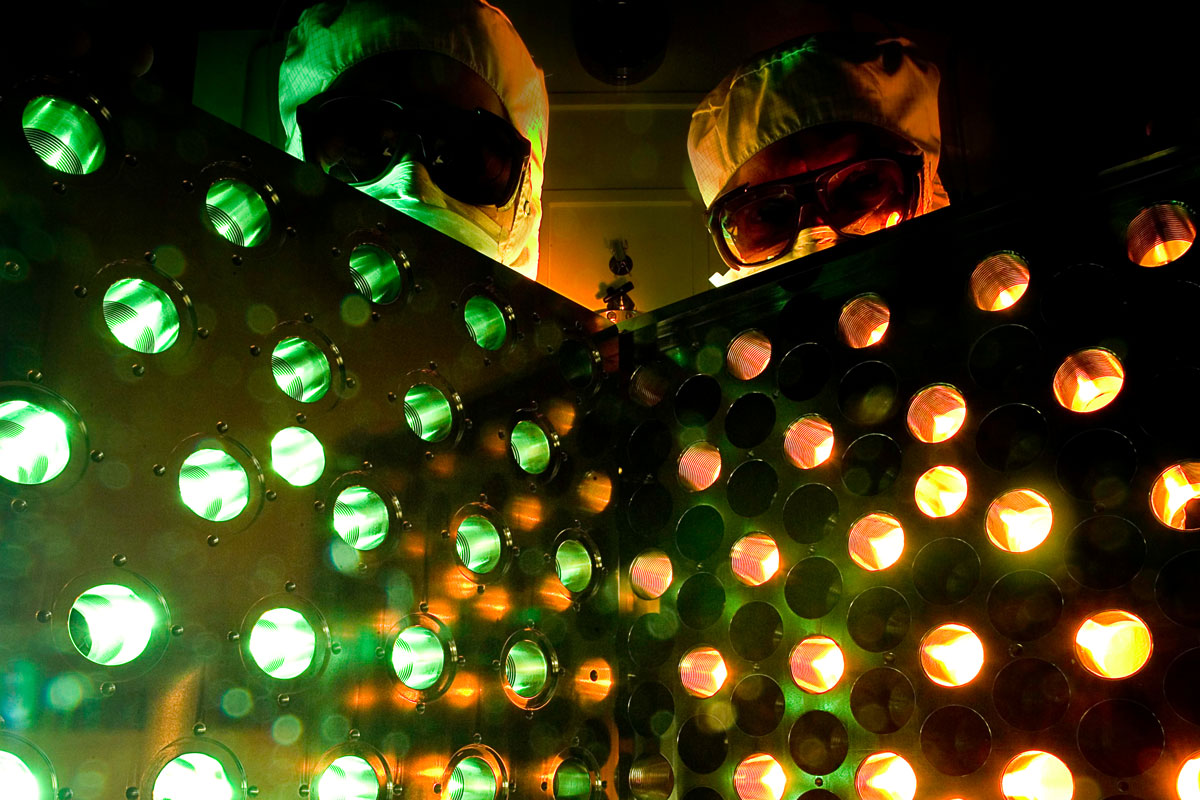 Two researches at the University of Rochester pose infront of an eform mirror