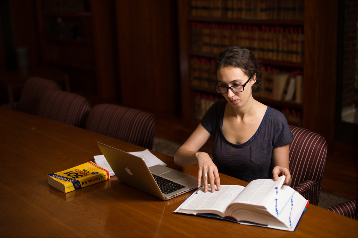 Student works on computer in the library