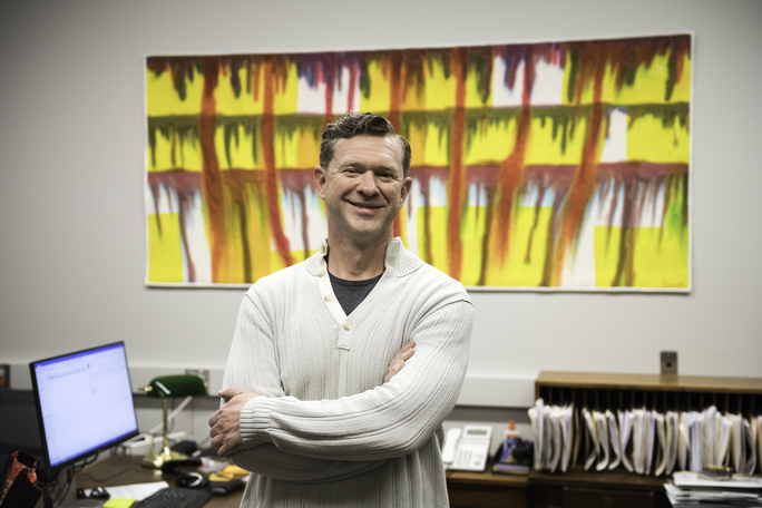 Randal Cook, University staff member, stands inside his office at the University of Rochester.
