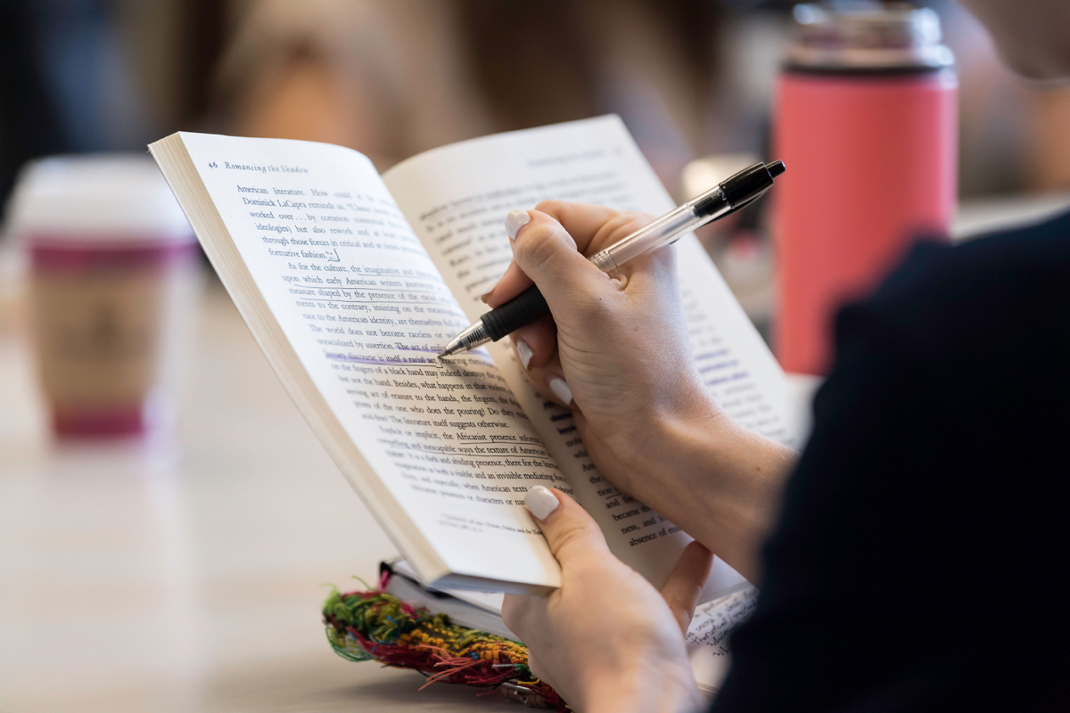 Student writes in classroom