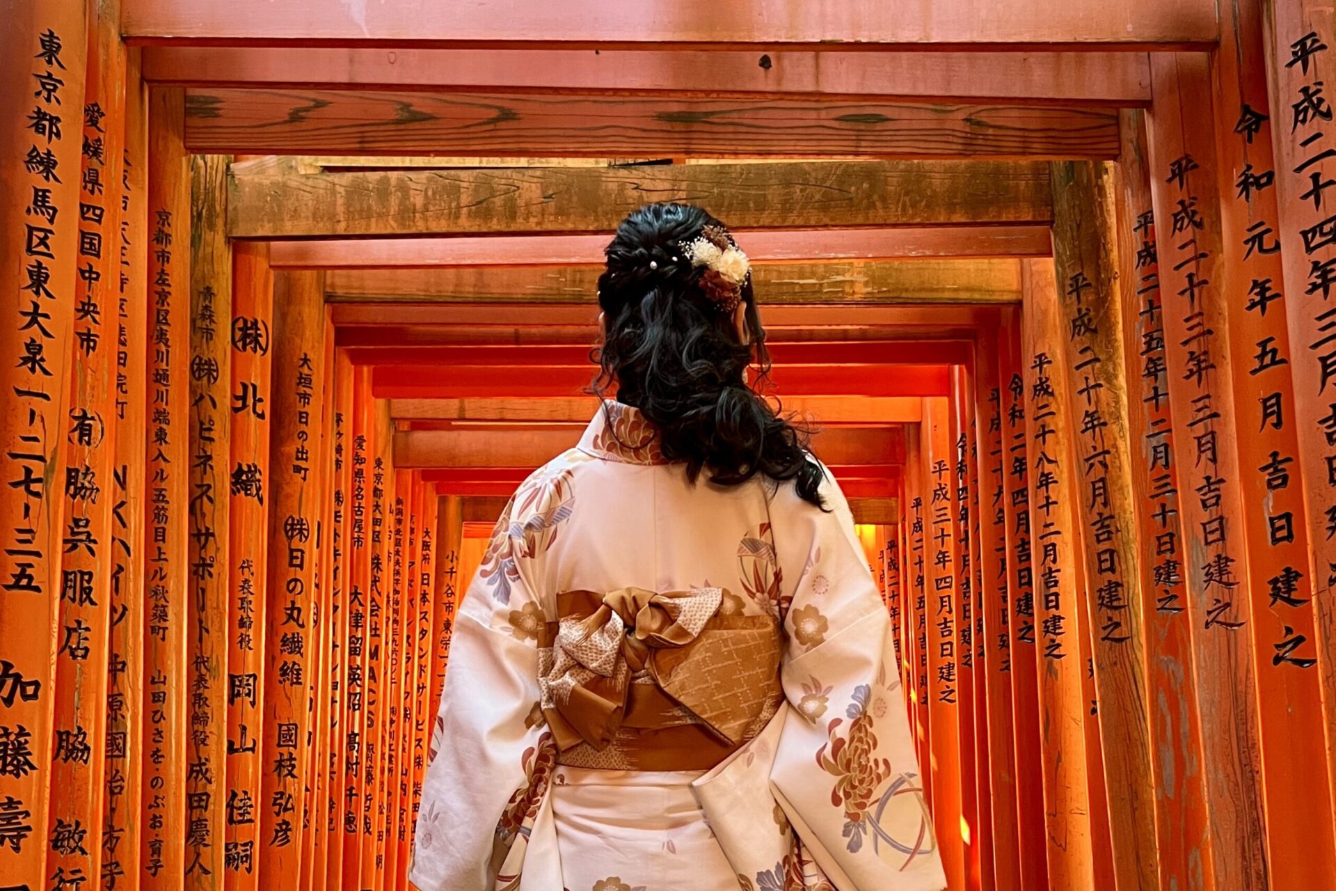 A student walking under unique Asian architecture