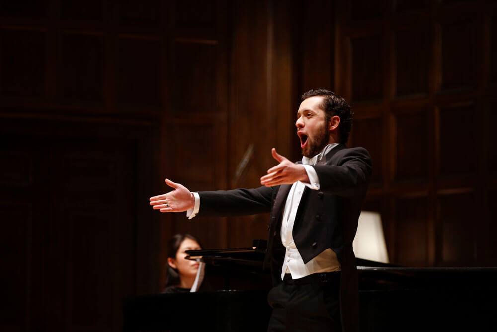 Voilin performers at music stands at University of Rochester Eastman School of Music Institute for Music Leadership
