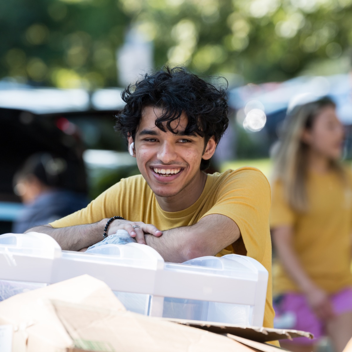 A student smiles during move-in day