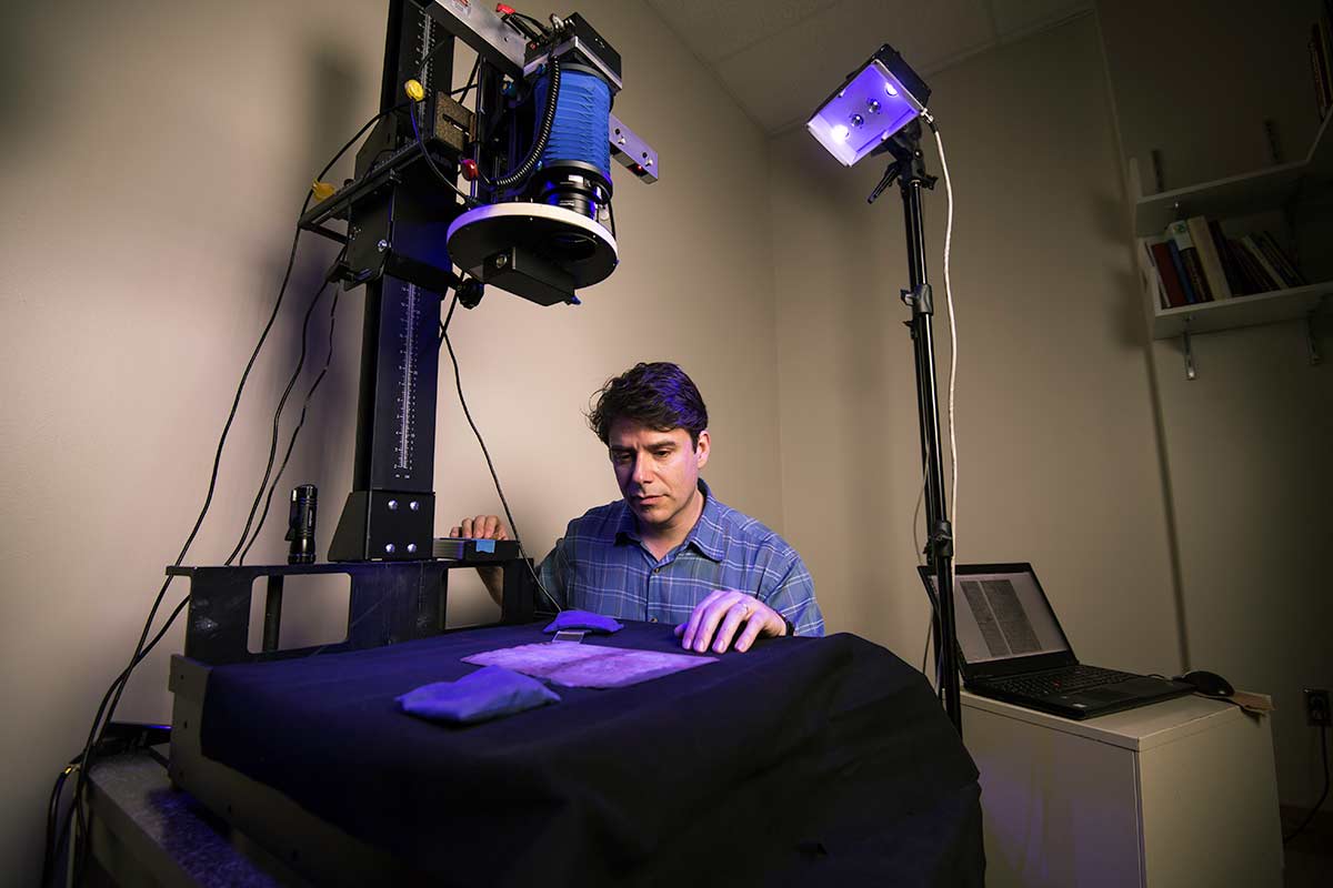 University of Rochester, research faculty member, Gregory Heyworth in his lab.