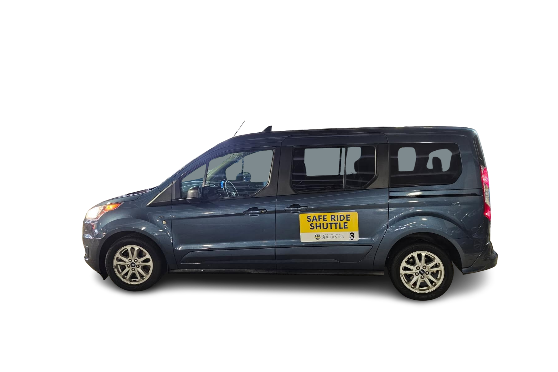 Blue van with a yellow and white sign on the side with the message Safe Ride Shuttle.